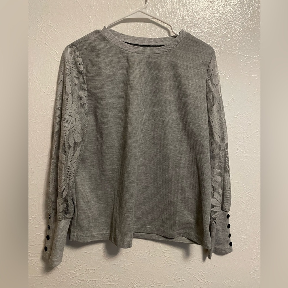 Shirt with lace sleeves.